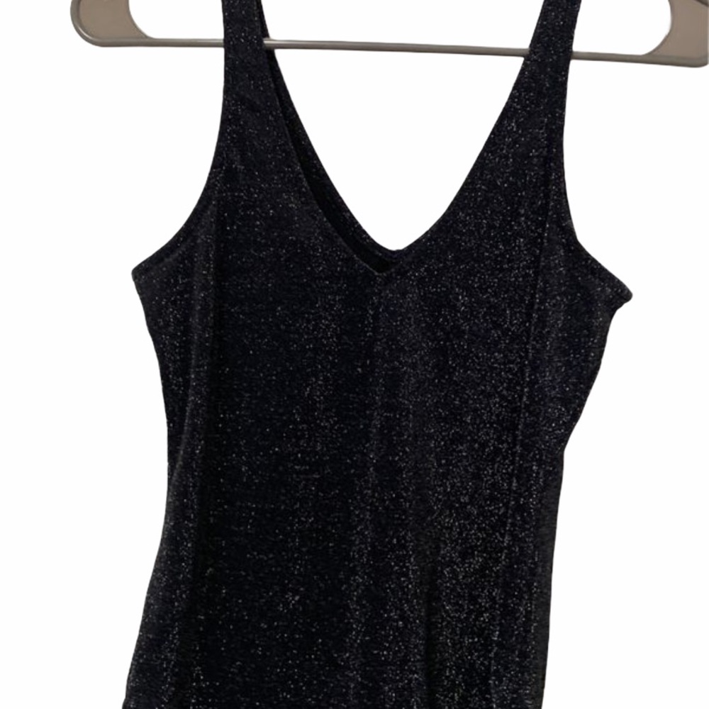 Shimmery body suit.